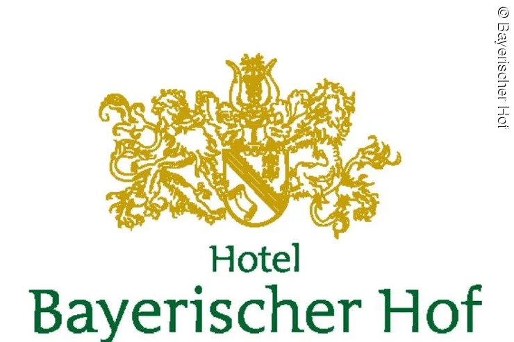 verschnörkelte Krone, darunter Schriftzug