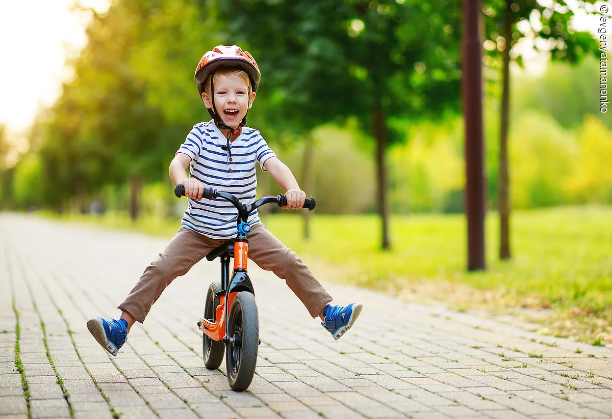 happy child boy rides a racetrack in Park in summer happy child boy rides a racetrack in Park in the summer